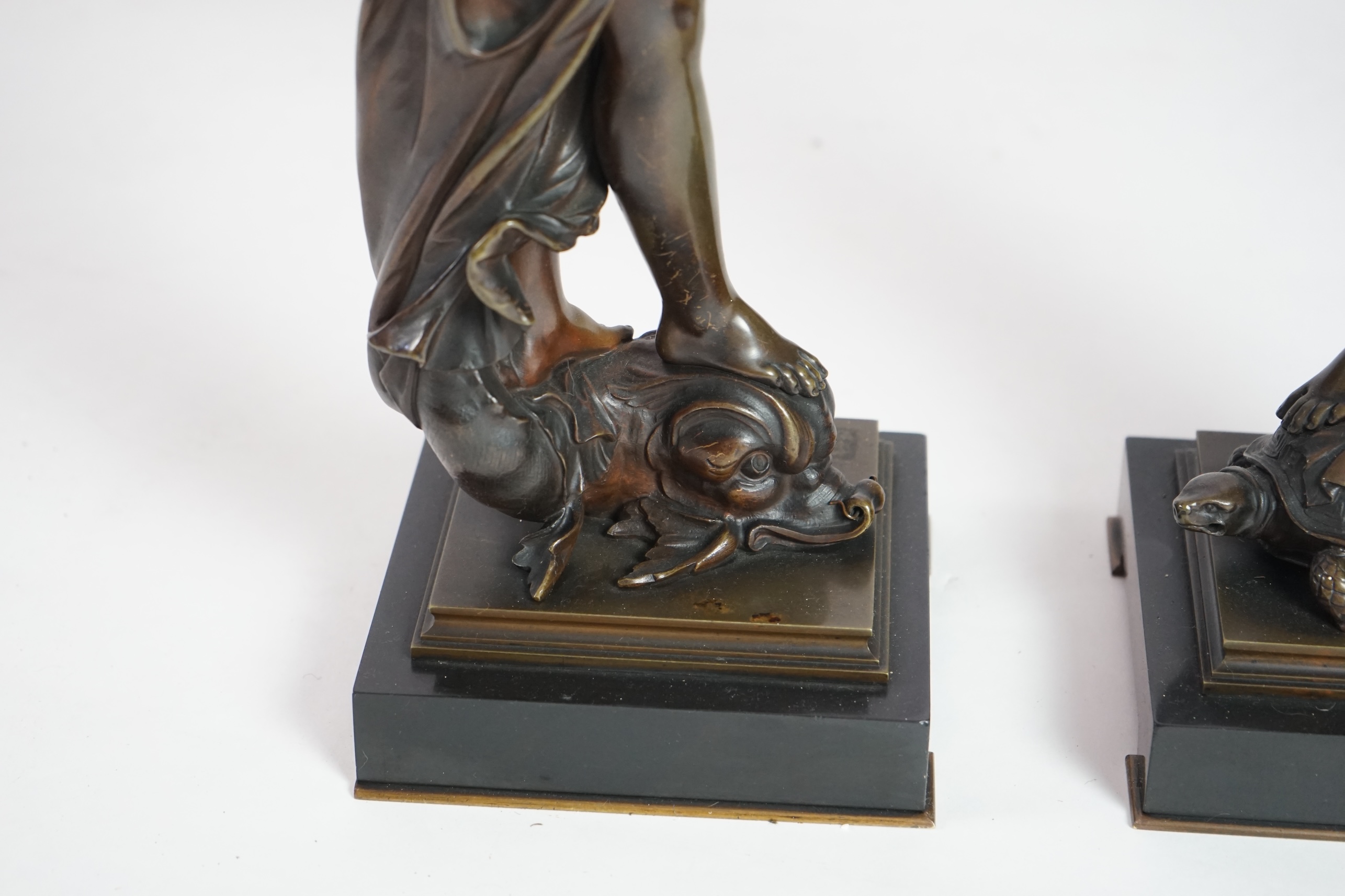 Eutrope Bouret, (French 1833-1906). A pair of late 19th century patinated bronze figures of Venus riding a dolphin and a nymph riding a tortoise